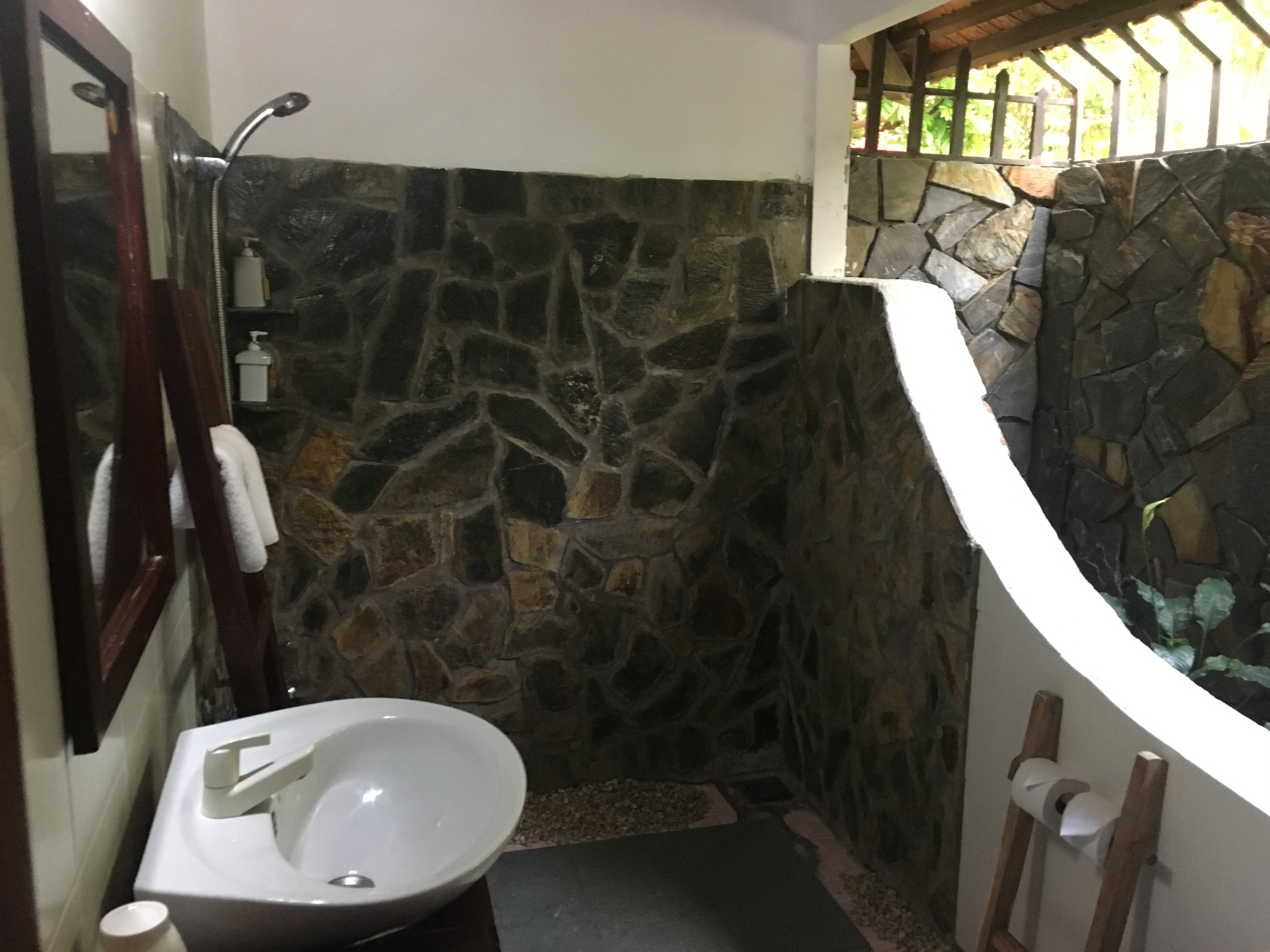 Partial outdoor bathroom at the bungalow at Thanh Kieu Beach Resort in Phu Quoc, Vietnam.