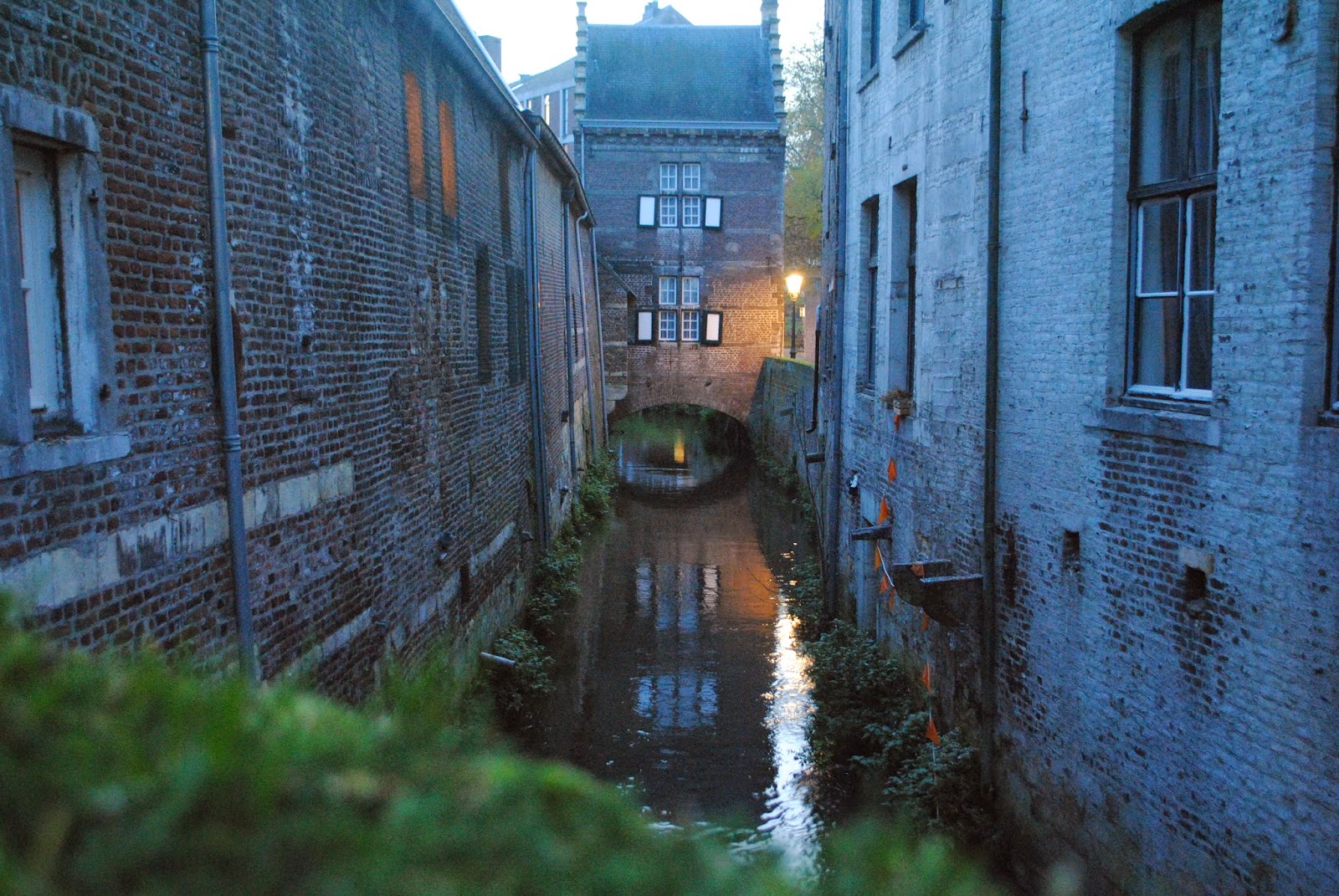 An evening photo of a canal in Maastricht, Netherlands.