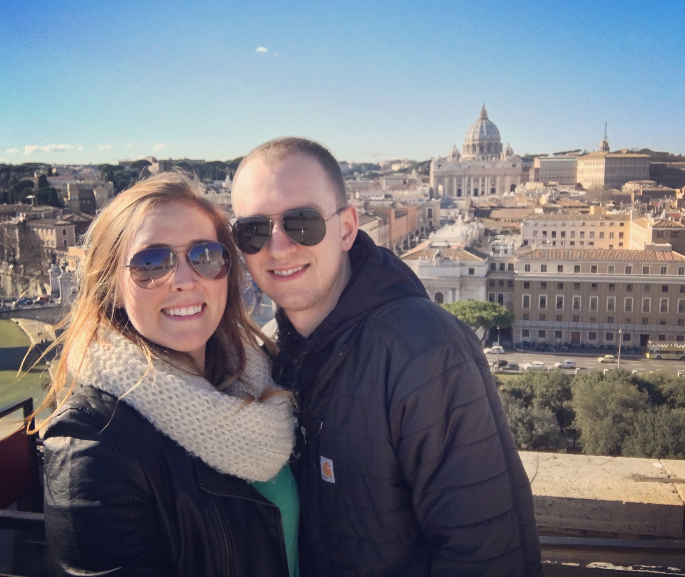 Erinn and Ben at the top of Castel Sant'Angelo with a view of Vatican City.