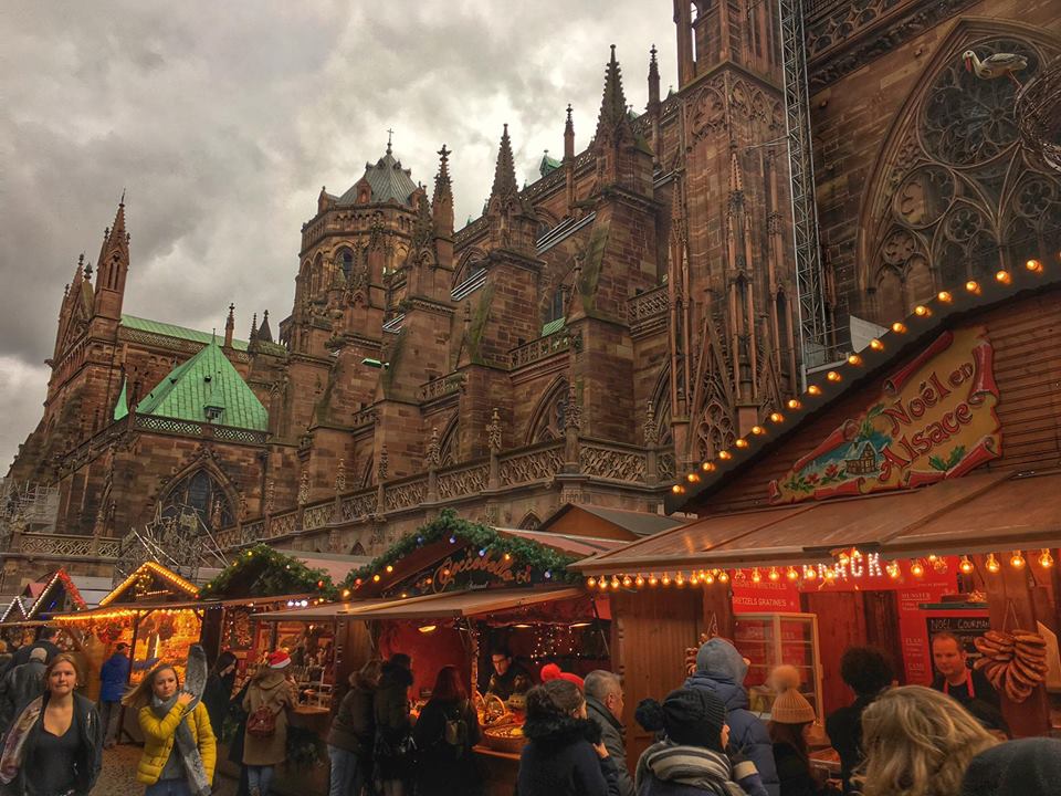 Christmas market booths set up in front of the Notre Dame cathedral in Strasbourg.