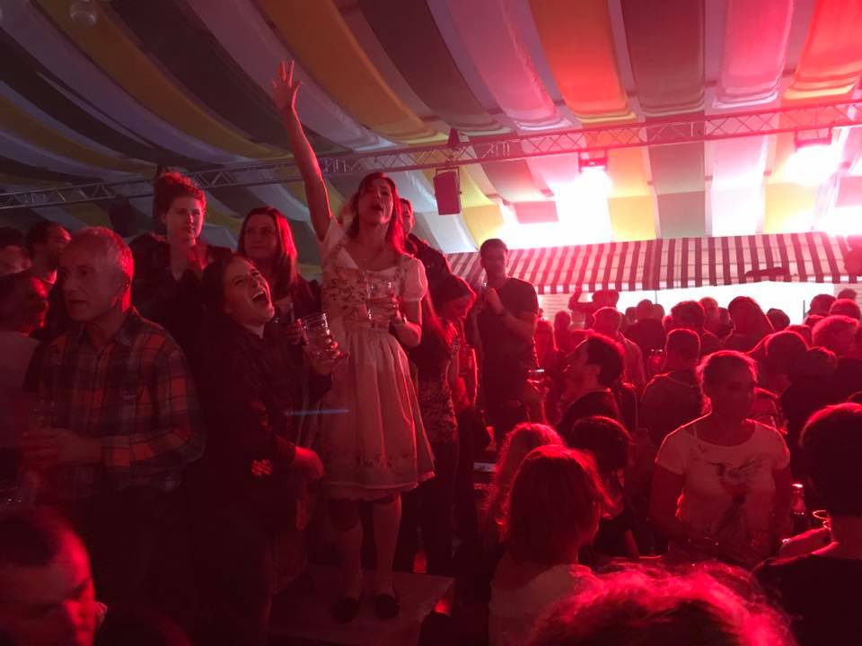 Crowds dancing on tables in the fest tents at Bad Dürkheim Wine Fest.