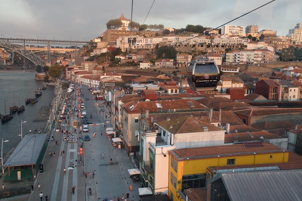 Riding the Teleférico de Gaia cable car down to the riverfront in Porto, Portugal.