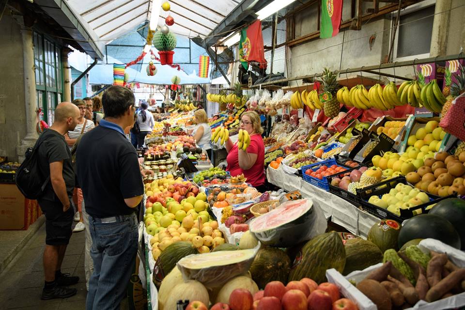 A fresh produce stand at Mercado do Bolhão in Porto, Portugal.