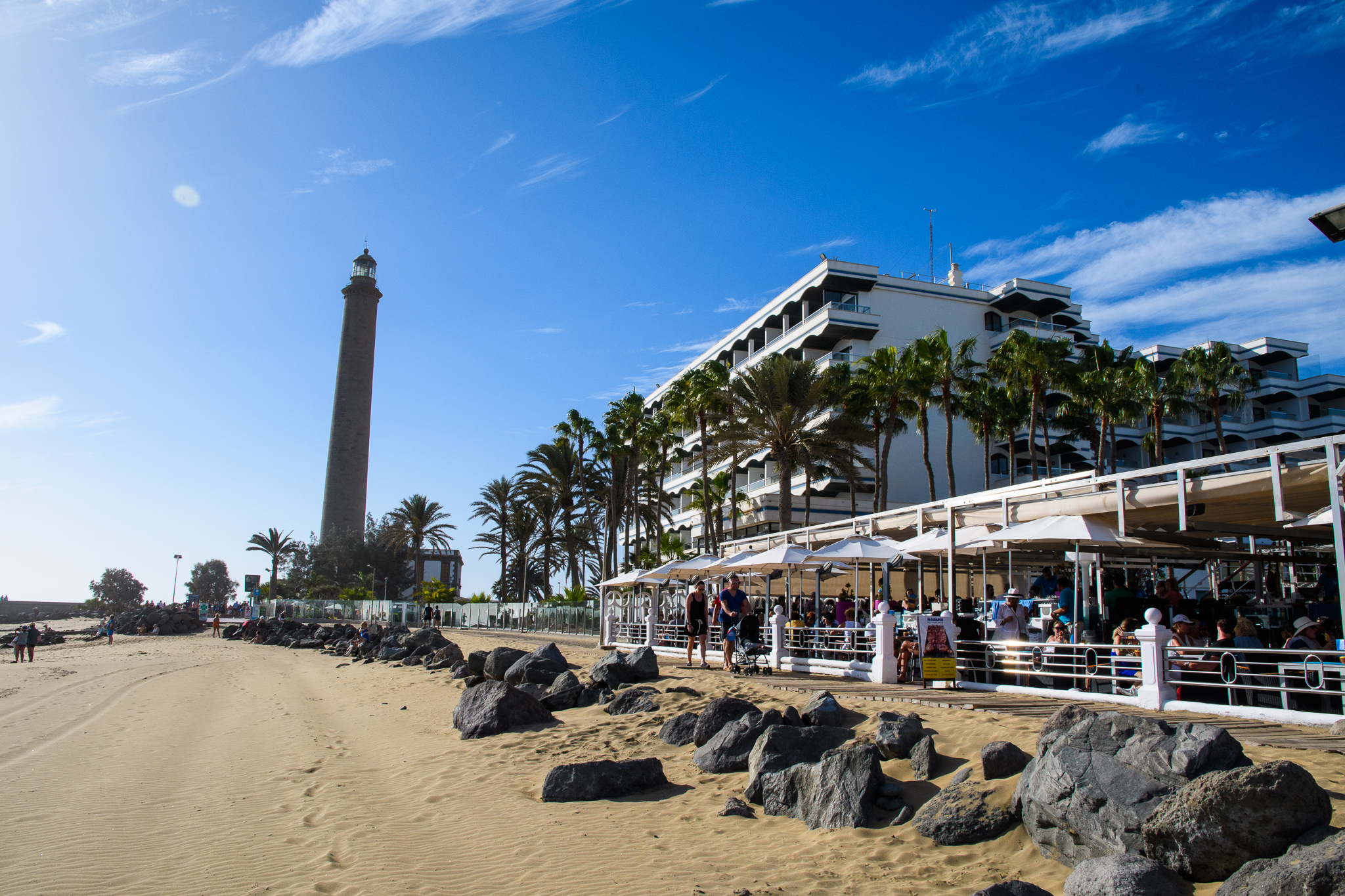 The lighthouse and beachfront promenade in Maspalomas.