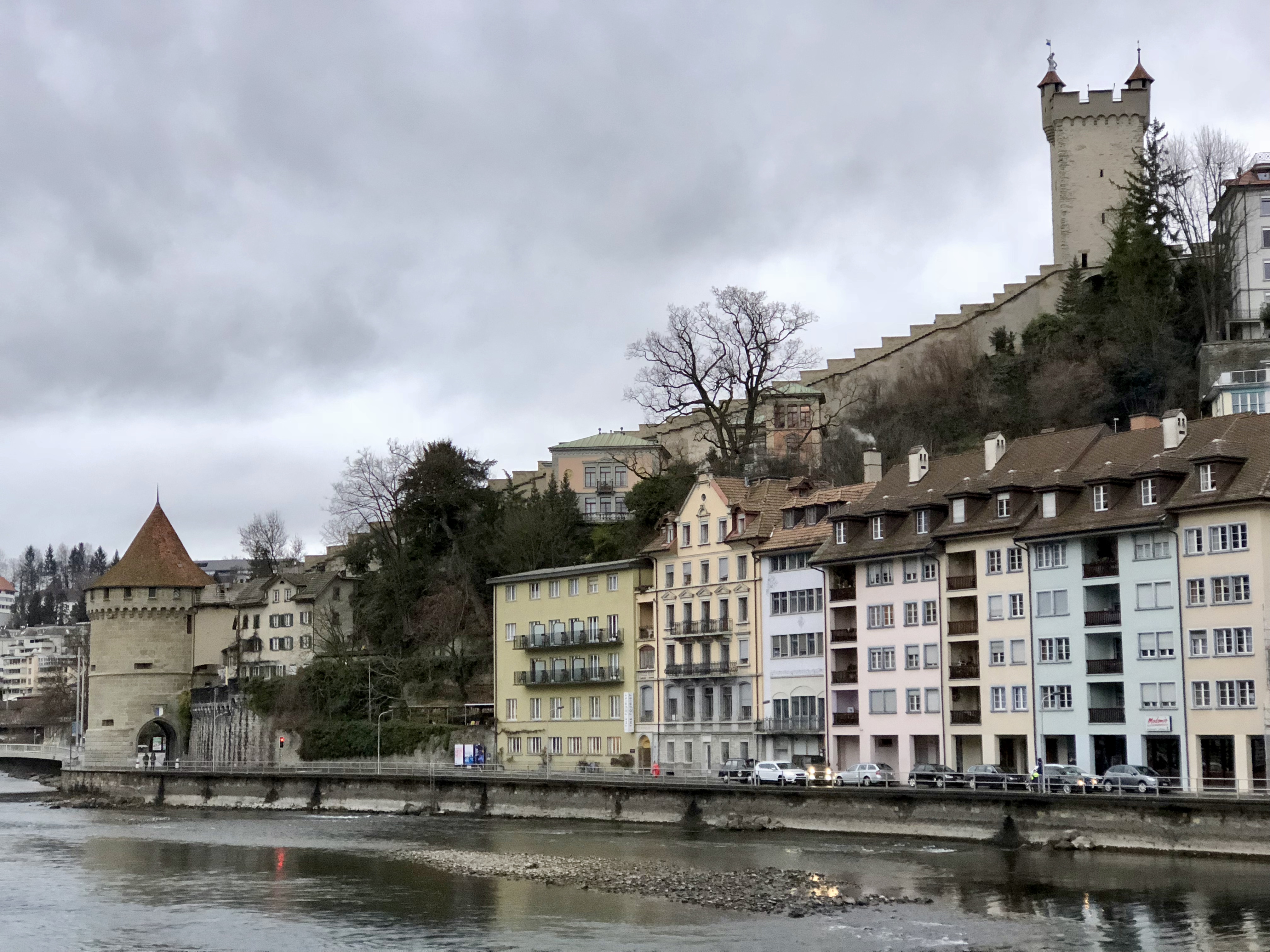 Lucerne, Switzerland, with an old fortress on the hill.