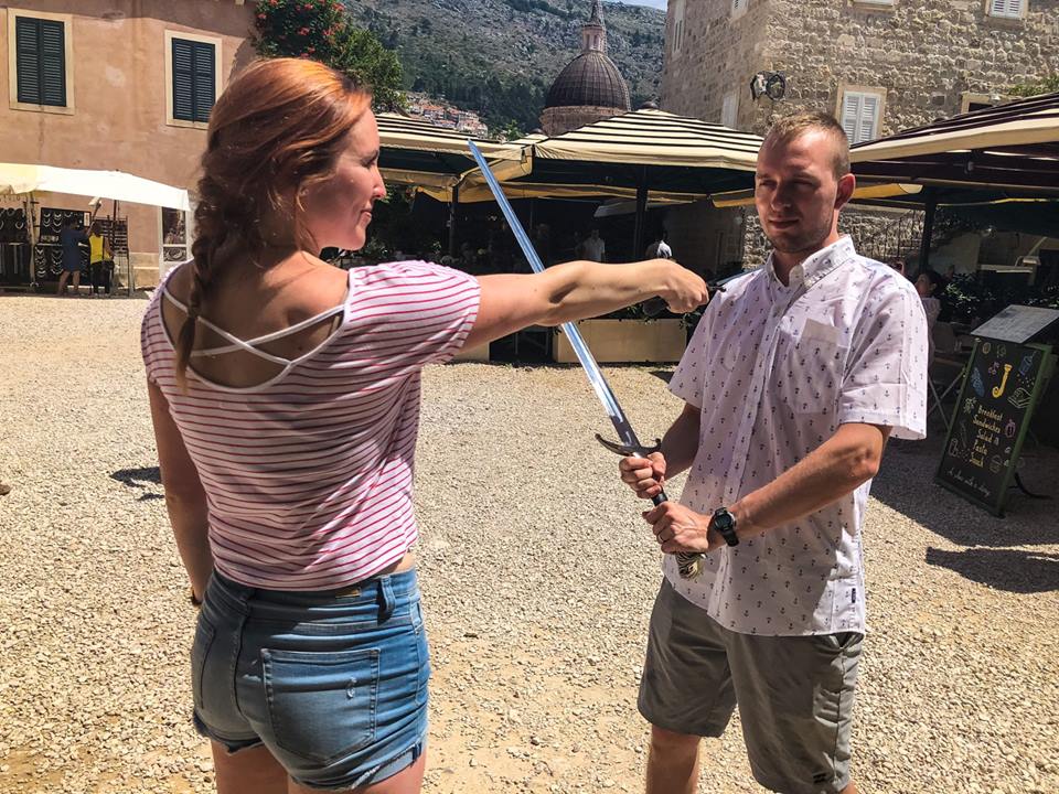 Erinn and Ben play with swords on the Game of Thrones tour in Dubrovnik, Croatia.