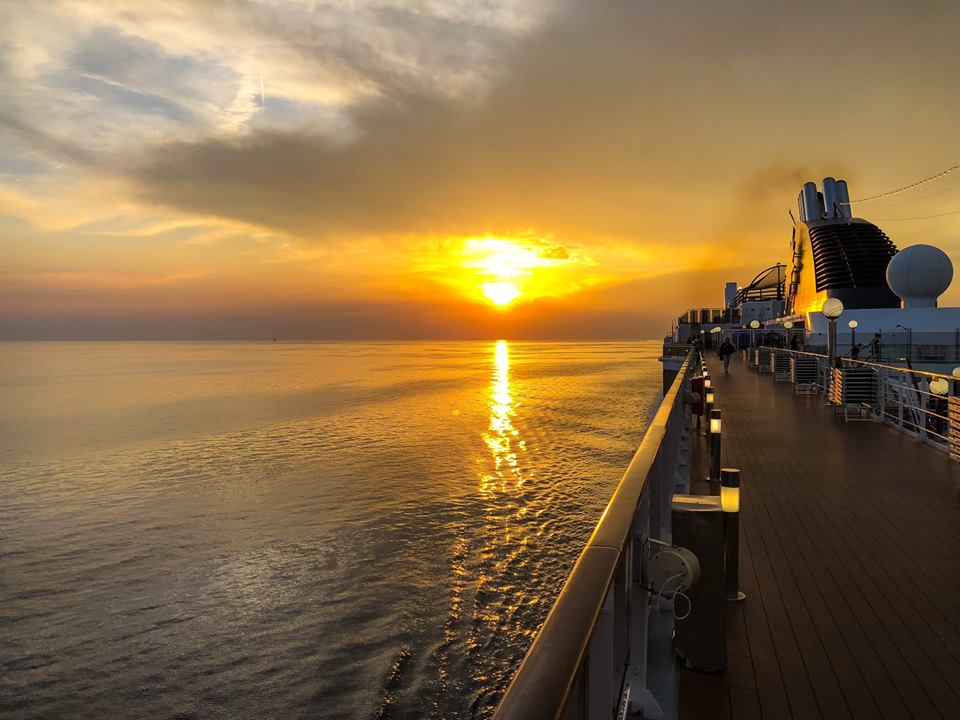 The sun setting over the water from the MSC Poesia. 