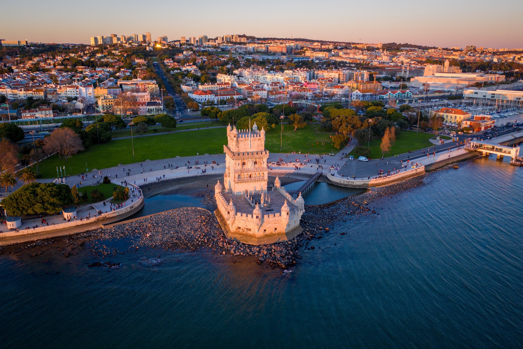 Drone view of Belém Tower at sunset.