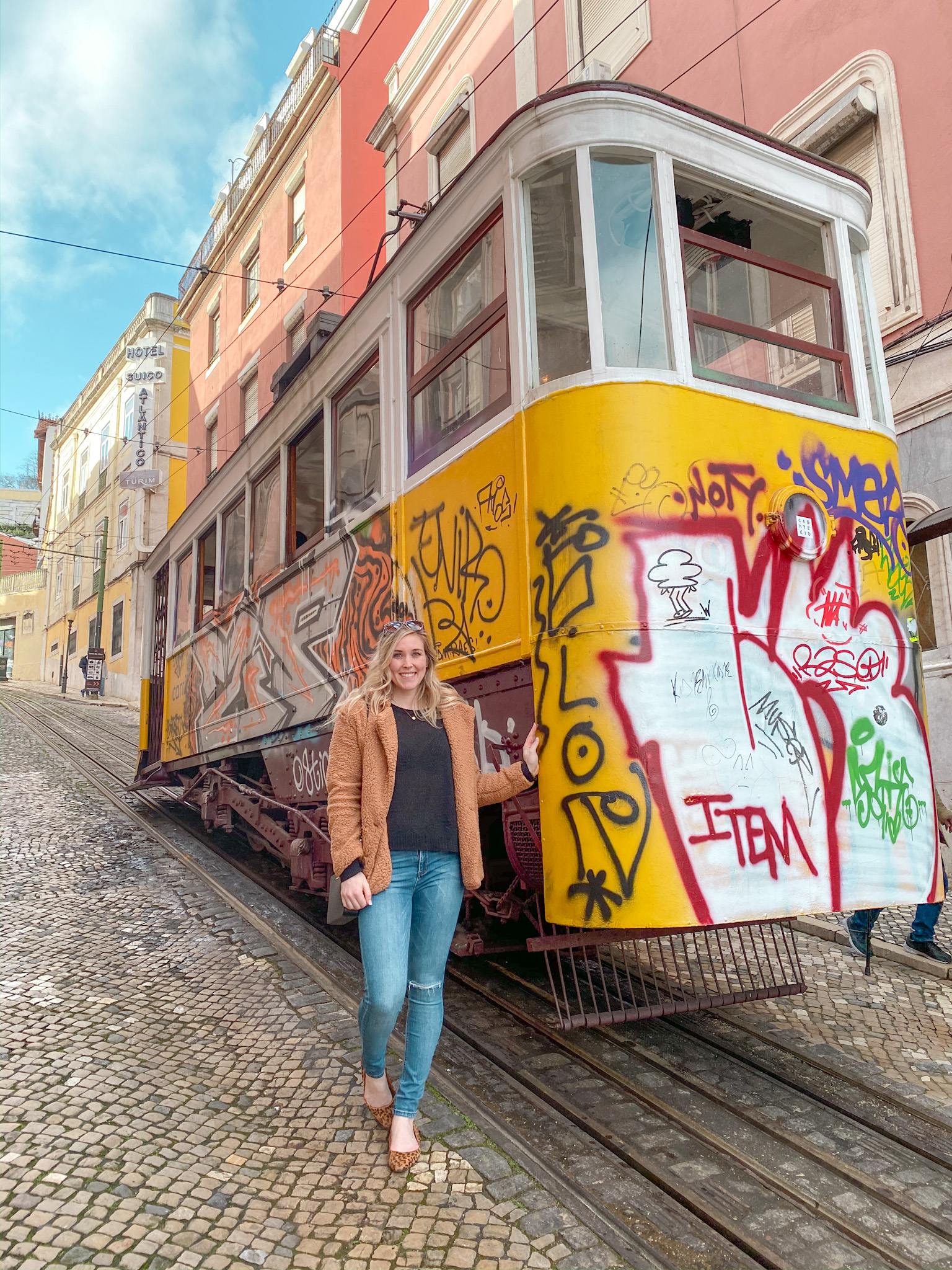 Erinn with the Glória Funicular cable car in Lisbon, Portugal.