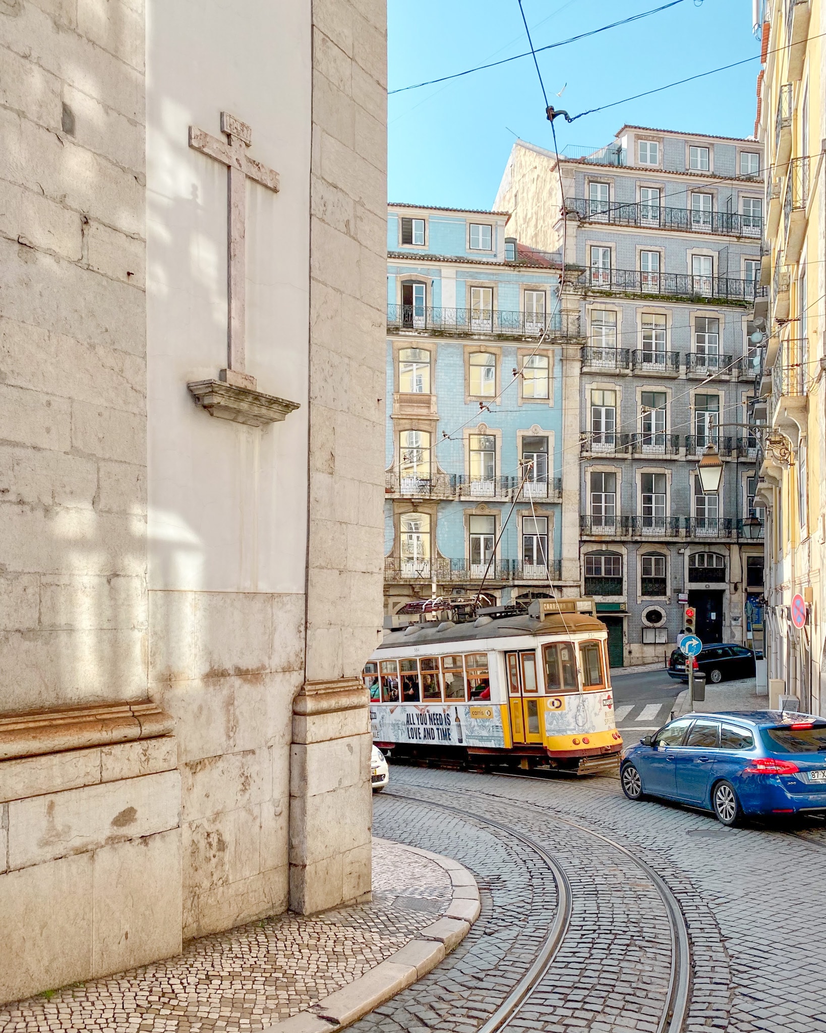 Tram 28 on winding streets in Lisbon, Portugal.