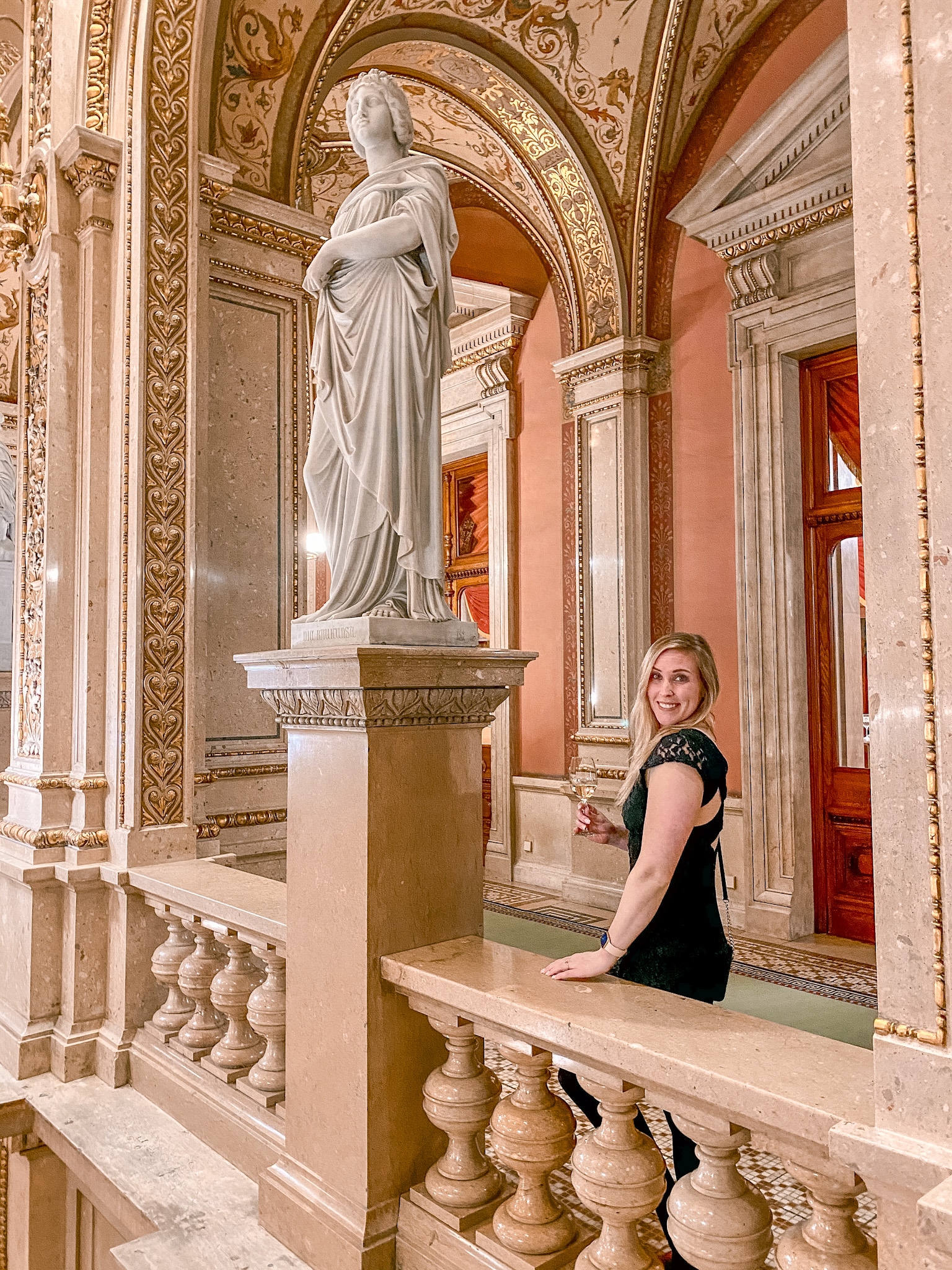 Erinn in the beautiful interior of Wiener Staatsoper (Vienna State Opera House). 