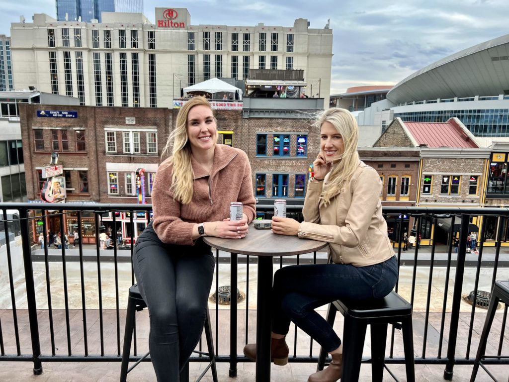 Erinn and Olivia enjoy a couple drinks at a rooftop bar at Lower Broadway in Nashville.