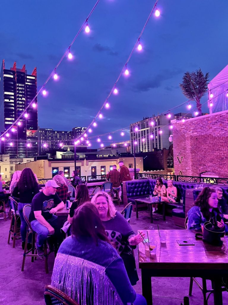A picture of the rooftop setting at Miranda Lambert's Casa Rosa with lovely pink string lights.