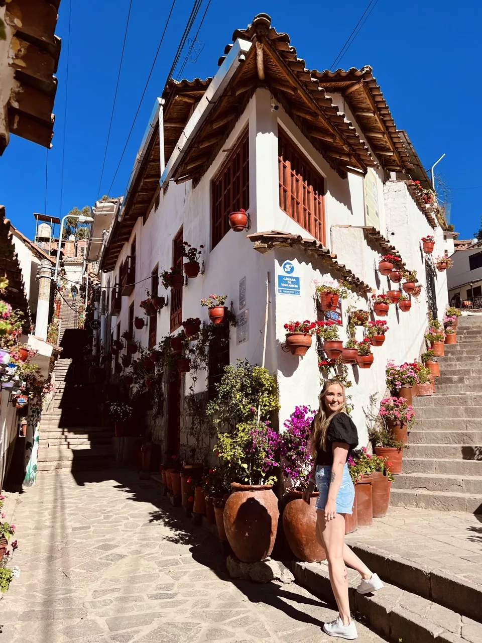 Erinn poses on Calle Siete Borreguitos in Cusco.