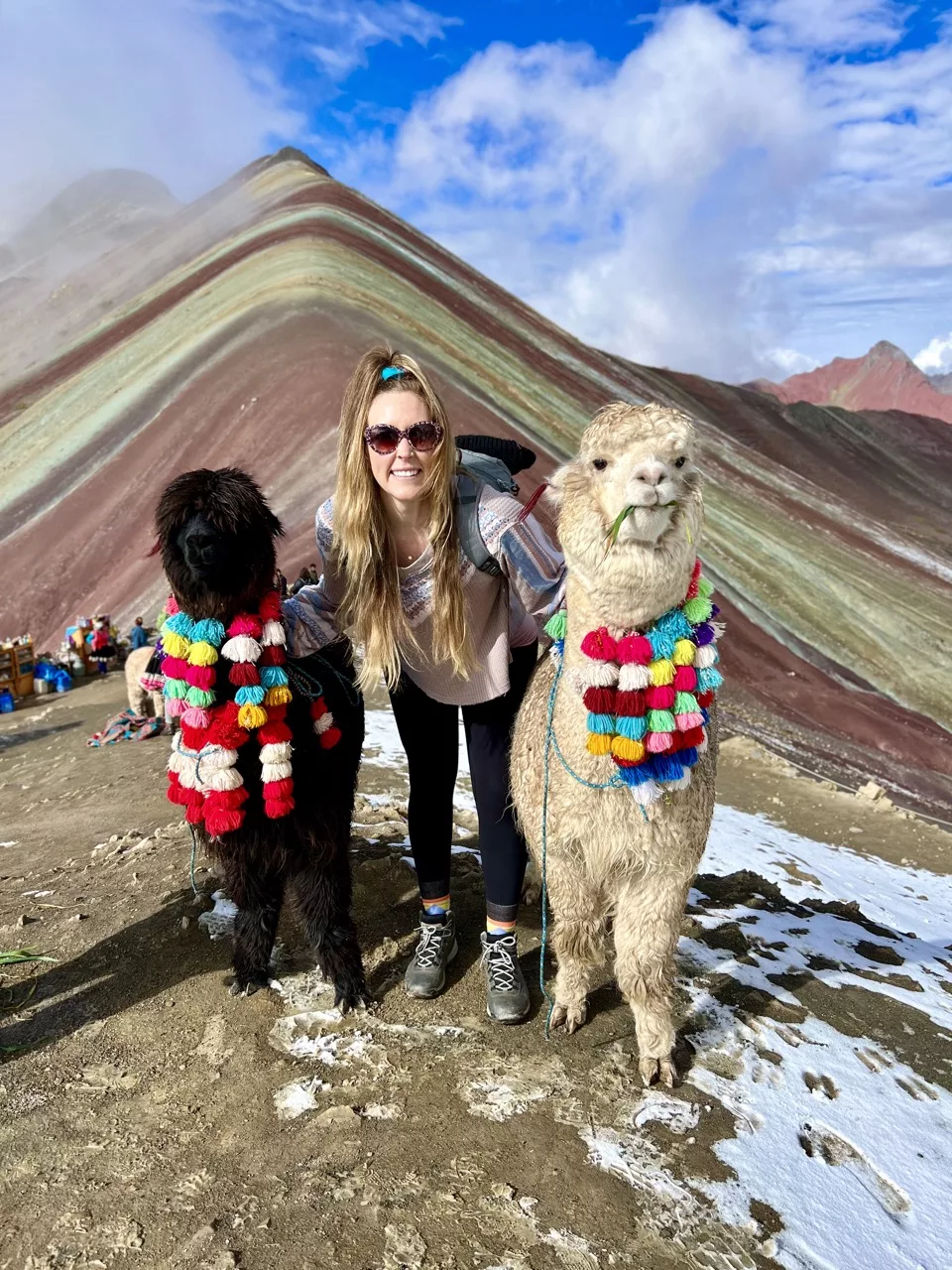 Erinn with alpacas at Rainbow Mountain